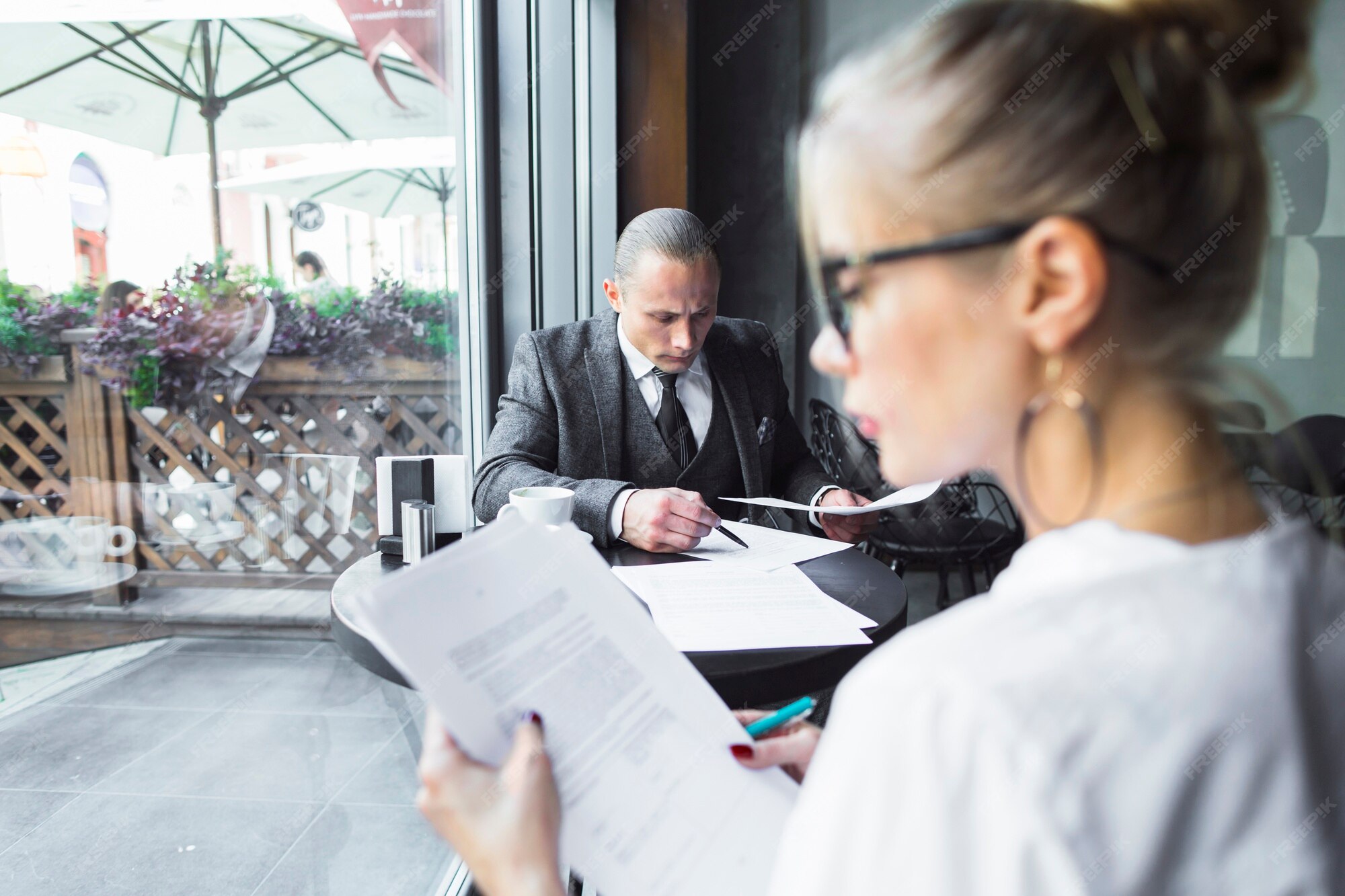 A young woman checking documents of law firm.