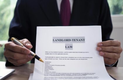 ss1 Attorney presenting a landlord-tenant law document while holding a pen